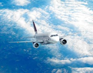 Commercial flight traveling to Hamad International Airport in Qatar.